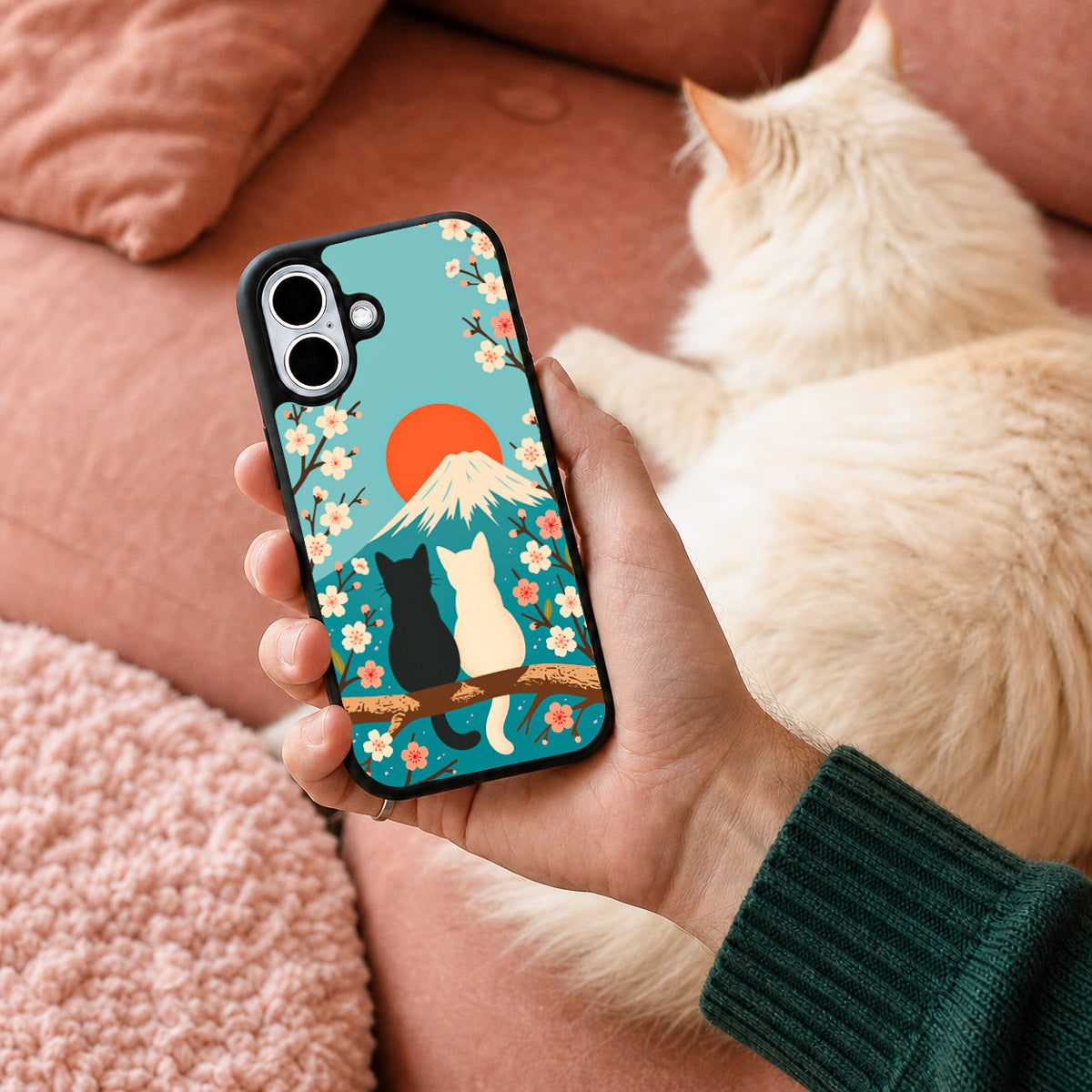 Fuji Cats iPhone 16 case held in hand – lifestyle view