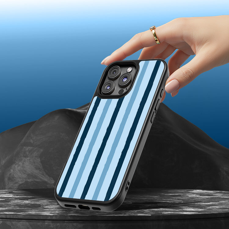 Phone case with blue and black striped design held by a hand against a blue background