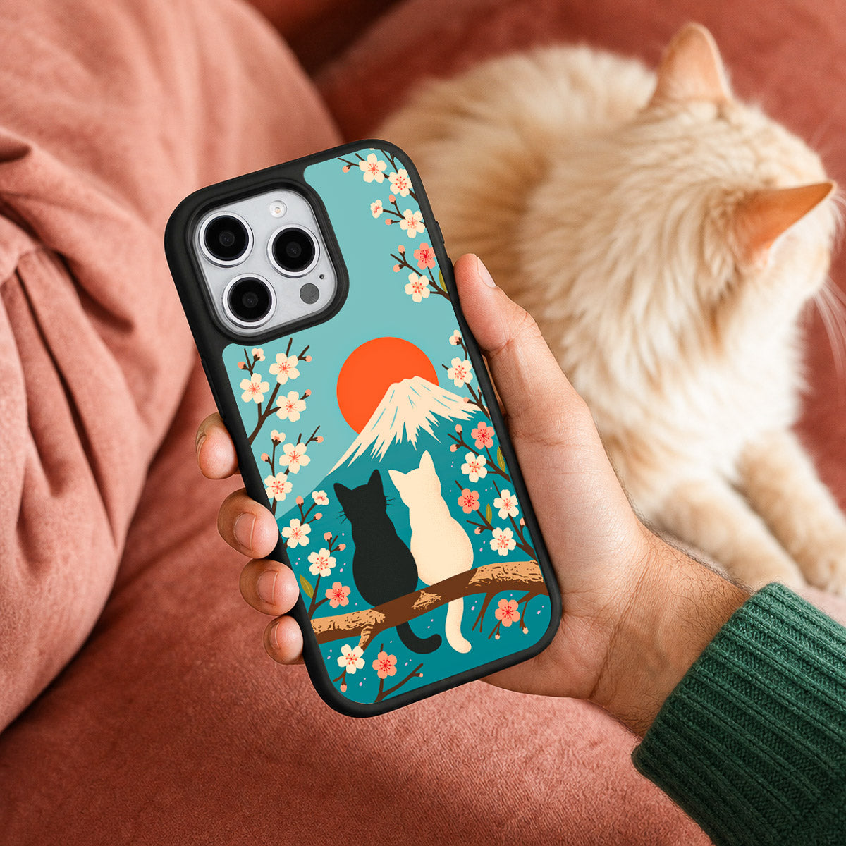 Fuji Cats iPhone 15 case held in hand – lifestyle view